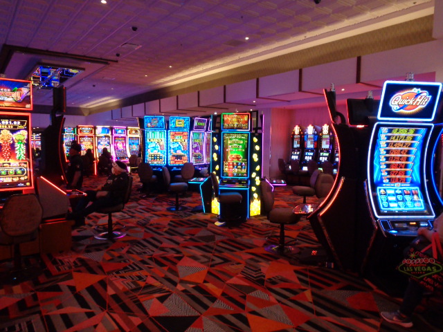 Colorful slot machines in a gaming area.