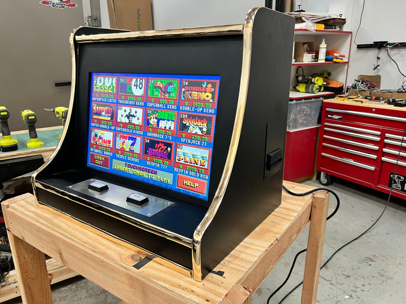 Colorful Keno game machine on wooden table.