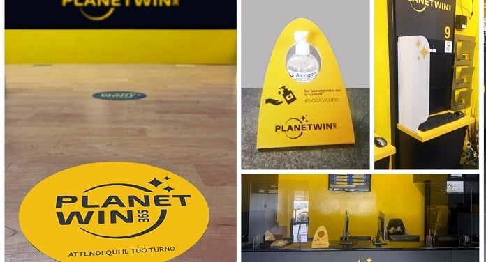 Yellow and black Planet Win branding display.