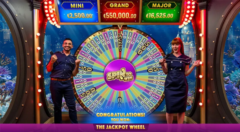 Game show hosts celebrating a jackpot win.
